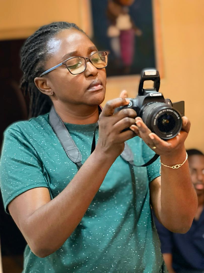 Devaan documenting an event with a camera